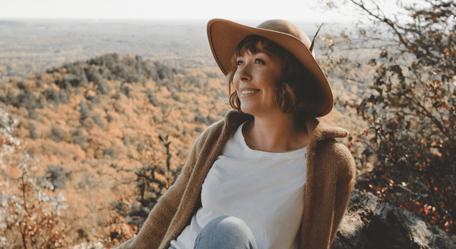 happy woman wearing a hat outdoors 640x350